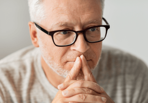 Older man considering dental implant tooth replacement options