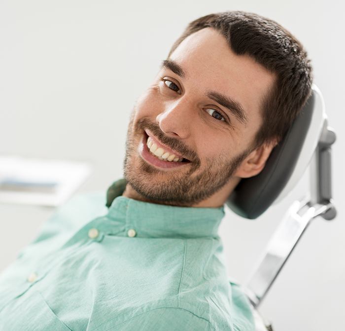 Man in dental chair relaxed thanks to sedation dentistry