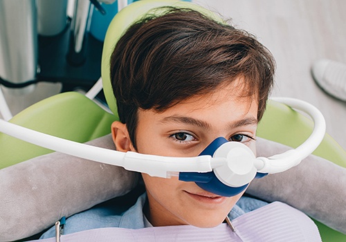 Young patient with nitrous oxide mask in place