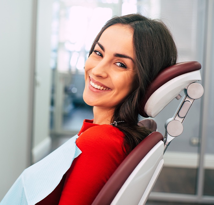 Woman smiling in high tech dental exam room