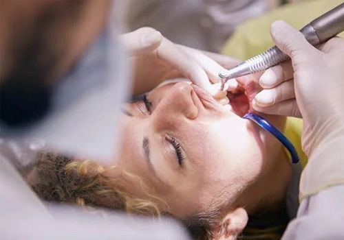 Dentist performing dental bonding treatment